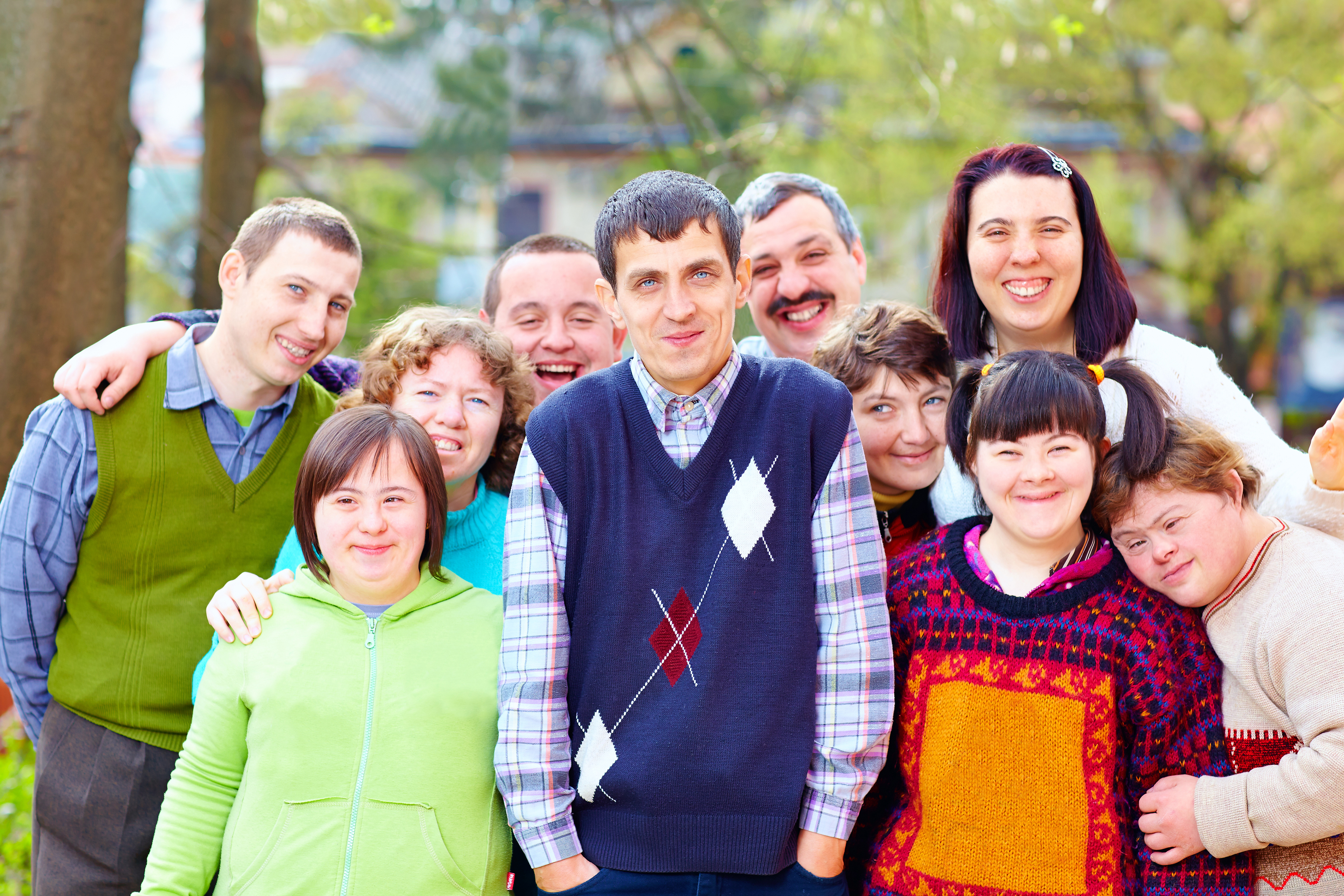 picture of a group of smiling people with varying abilities